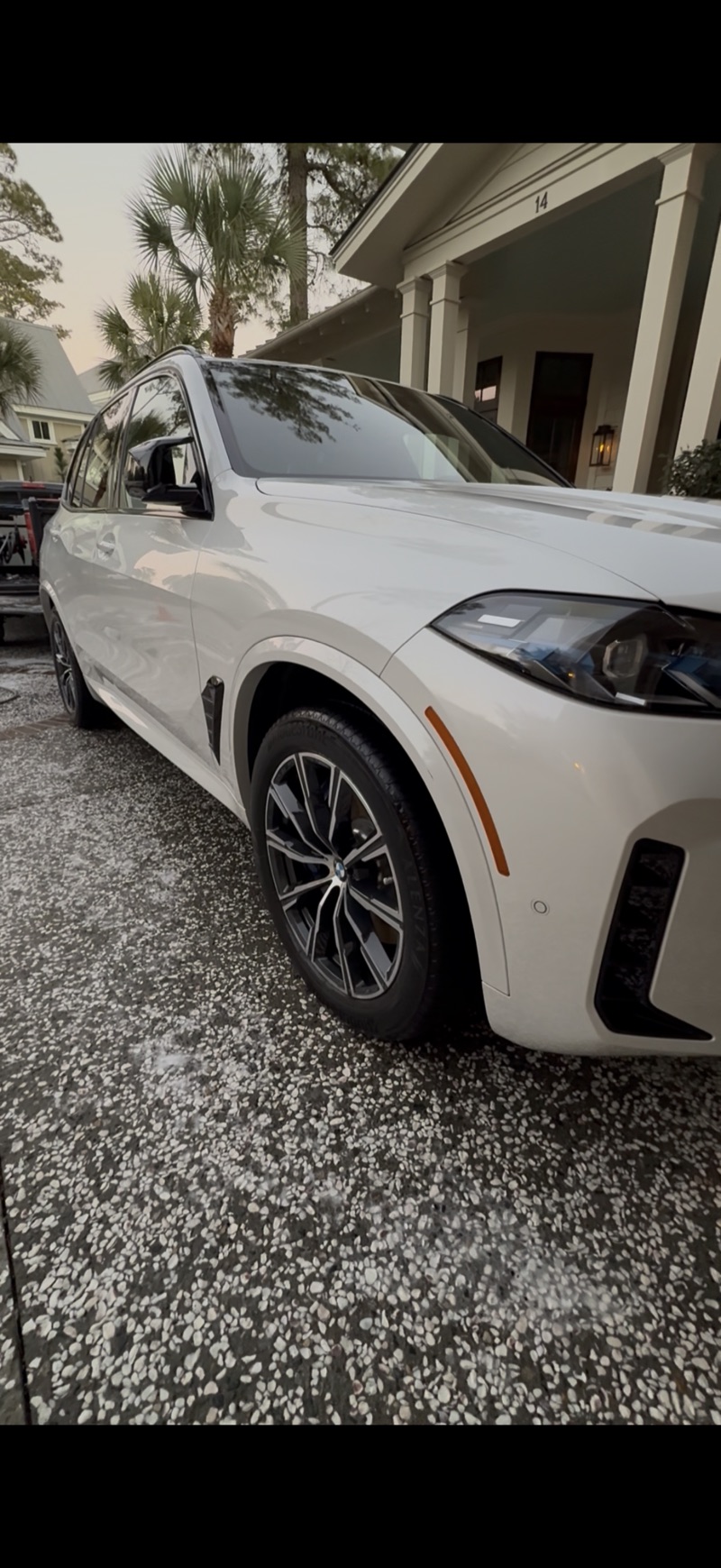 White BMW X5 freshly detailed in Bluffton SC driveway